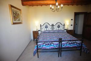 Postel nebo postele na pokoji v ubytování Agriturismo Il Poderaccio