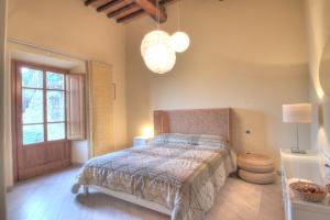 Postel nebo postele na pokoji v ubytování Agriturismo Il Poderaccio
