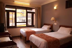 Voodi või voodid majutusasutuse Tibet Guest House toas