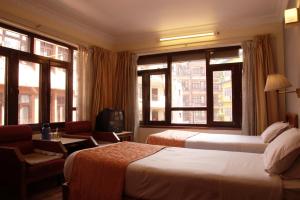 Voodi või voodid majutusasutuse Tibet Guest House toas