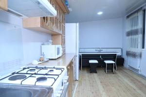 Η κουζίνα ή μικρή κουζίνα στο Arsego Hostel