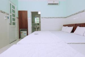 Postel nebo postele na pokoji v ubytování Sevensea Vung Tau