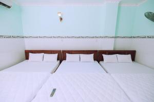 Postel nebo postele na pokoji v ubytování Sevensea Vung Tau