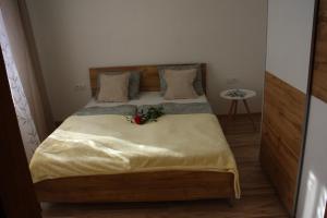 A bed or beds in a room at Apartmánový dom Mária