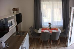 A kitchen or kitchenette at Apartmánový dom Mária