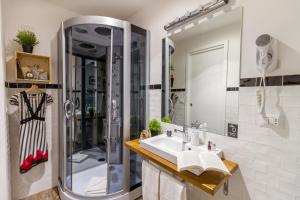 a bathroom with a shower and a sink at Athena Guest House in Rome +20 photos
