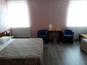 Postel nebo postele na pokoji v ubytování Hotel San Giorgio