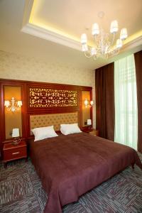 Кровать или кровати в номере AZPETROL HOTEL QUSAR