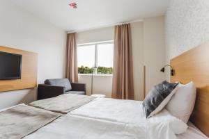 Ένα ή περισσότερα κρεβάτια σε δωμάτιο στο Hotel Spekeröd