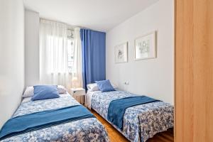 Posteľ alebo postele v izbe v ubytovaní Cálido apartamento con piscina en Barcelona + 16 fotografií