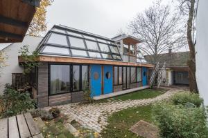a house with a blue door and windows at Apartments near metro station in Vienna