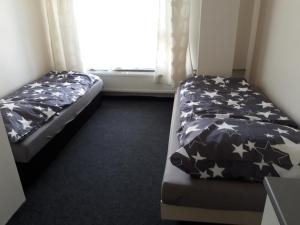 מיטה או מיטות בחדר ב-Apartmany Fit Gym