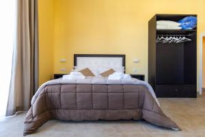 Postel nebo postele na pokoji v ubytování B&B Trianon