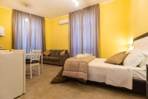 Postel nebo postele na pokoji v ubytování B&B Trianon