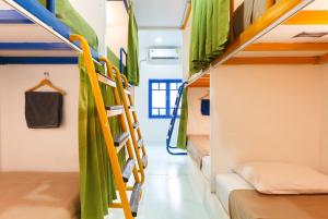 Postel nebo postele na pokoji v ubytování Aekkeko hostel