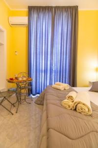 Postel nebo postele na pokoji v ubytování B&B Trianon