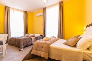 Postel nebo postele na pokoji v ubytování B&B Trianon