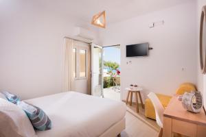 Posteľ alebo postele v izbe v ubytovaní Hermes Beach Front