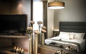 Postel nebo postele na pokoji v ubytování Hotel Chivasso