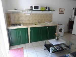 Kuchyň nebo kuchyňský kout v ubytování Residence Virginie