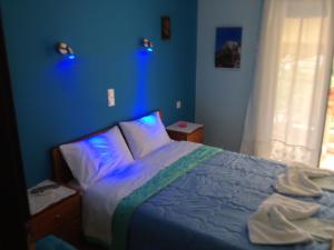 Ένα ή περισσότερα κρεβάτια σε δωμάτιο στο Kostas Rooms