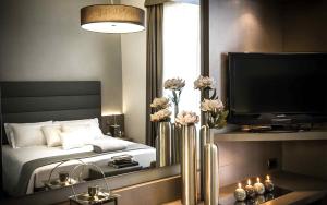 Postel nebo postele na pokoji v ubytování Hotel Chivasso