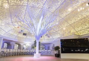 a room with a ceiling with a tree on it at Vetryakov Boutique Hotel in Voronezh