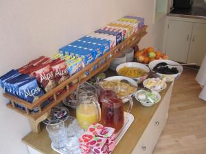 a counter top filled with lots of different types of food at Mabledon Court Hotel in London