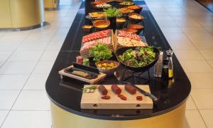 a buffet with many different types of food at Thon Hotel Opera in Oslo