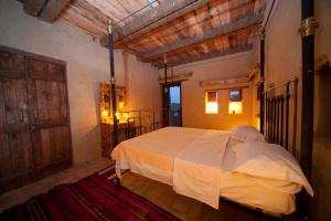 Postel nebo postele na pokoji v ubytování Taziry Ecolodge Siwa