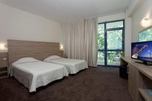 Ліжко або ліжка в номері Elena Hotel and Wellness - All Inclusive