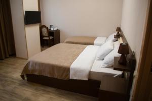 Voodi või voodid majutusasutuse Family Hotel Triston toas