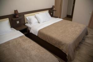 Voodi või voodid majutusasutuse Family Hotel Triston toas