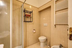a bathroom with a toilet and a shower at Magenta Collection Manara 4 in Rome