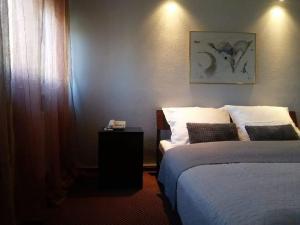 Postel nebo postele na pokoji v ubytování Inter Hotel