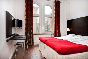 Giường trong phòng chung tại Hotel Jämteborg