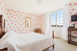 Ein Bett oder Betten in einem Zimmer der Unterkunft Hotel Les Goelands
