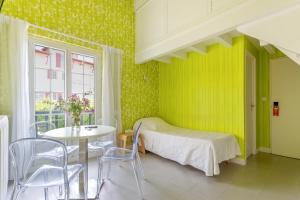Ein Bett oder Betten in einem Zimmer der Unterkunft Hotel Les Goelands