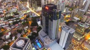 an aerial view of a city at night at Riu Plaza Panamá in Panama City