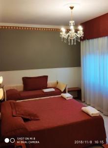 Кровать или кровати в номере Hotel Minerva