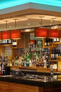 a bar with a lot of bottles of alcohol at Future Inn Plymouth in Plymouth