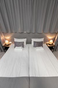 מיטה או מיטות בחדר ב-HappyInn Rooms