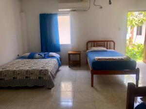 Letto o letti in una camera di Hotel Santorini