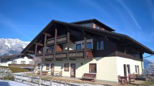 a large house with a black and white at Apartment Bea in Schladming