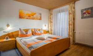 Posteľ alebo postele v izbe v ubytovaní Haus Annemarie Apartments Kartitsch - Hochpustertal