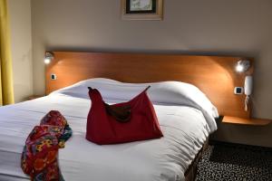Postel nebo postele na pokoji v ubytování In Situ Hotel