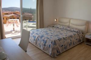 Postel nebo postele na pokoji v ubytování Hotel La Contessa + 37 fotografií