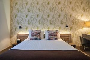 Voodi või voodid majutusasutuse Hotel Bosco toas