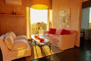 a living room with two white couches and a table at BDL Beach Design loft Two in José Ignacio