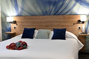 Postel nebo postele na pokoji v ubytování In Situ Hotel